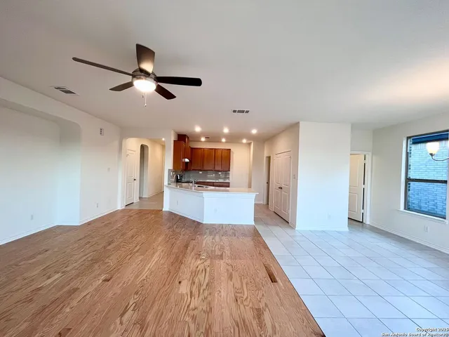 a kitchen with a sink a stove and cabinets