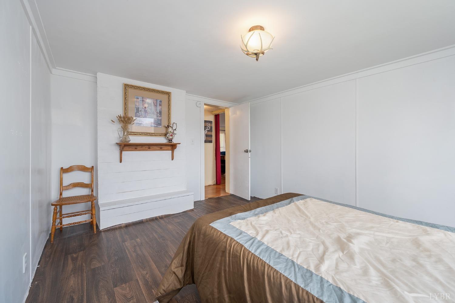 1105 Veteran Road Vinton, VA 24179 - Photo 17 of 37 a bedroom with a bed and a table