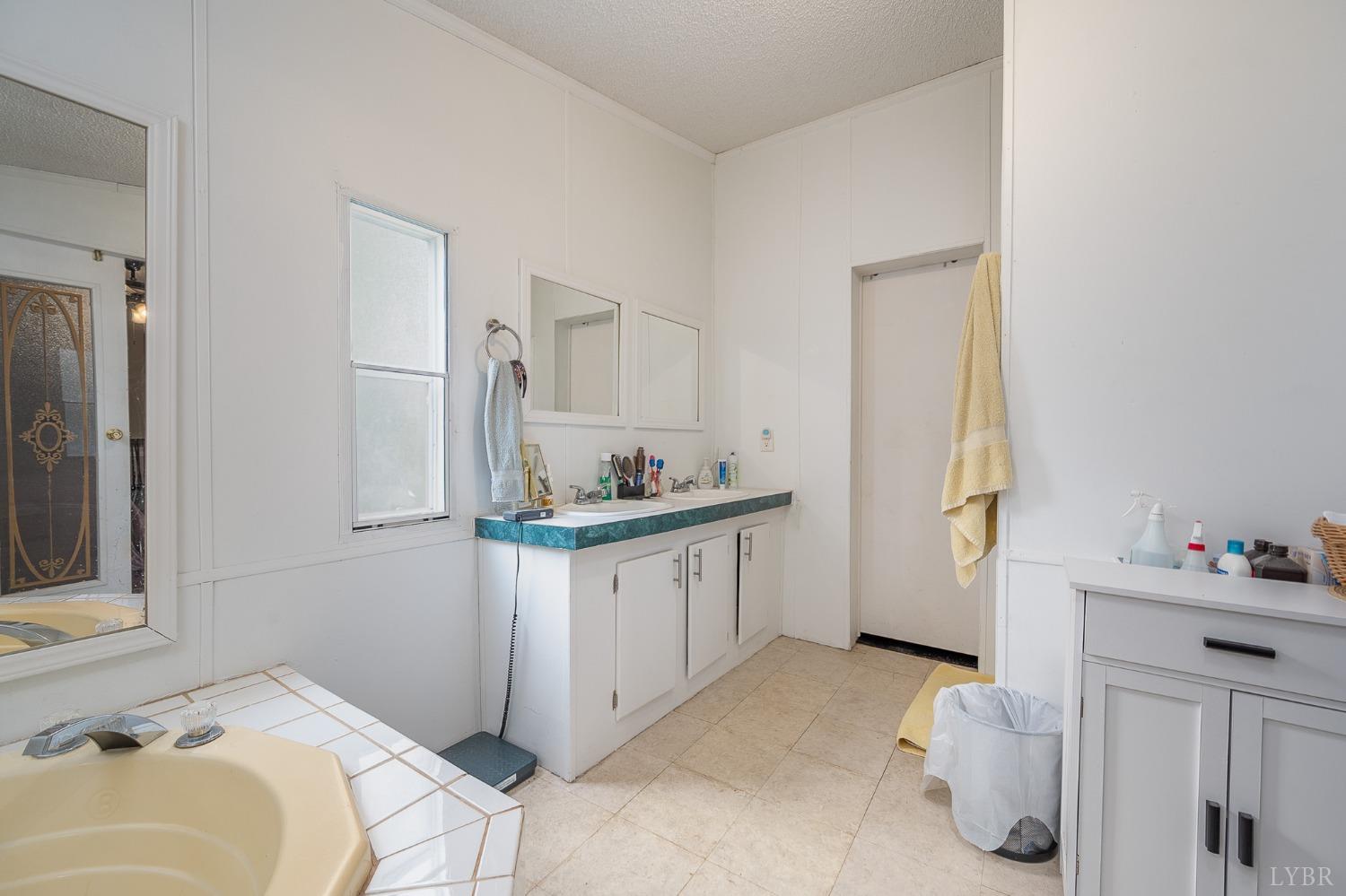 1105 Veteran Road Vinton, VA 24179 - Photo 23 of 37 a bathroom with a sink and a mirror