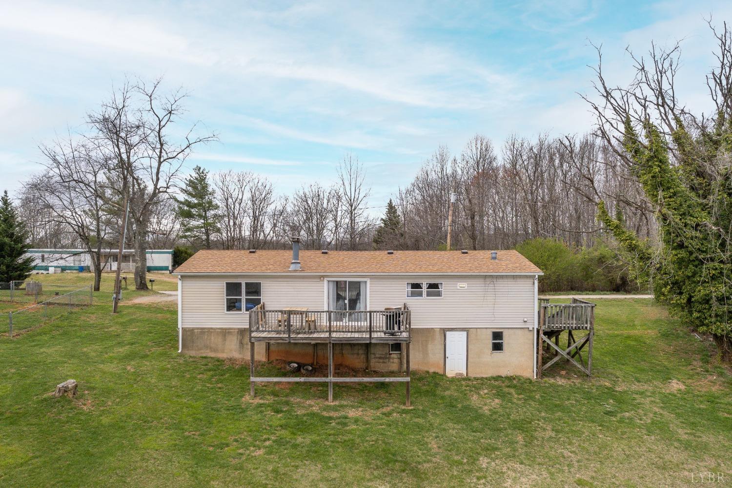 1105 Veteran Road Vinton, VA 24179 - Photo 27 of 37 a aerial view of a house with a yard table and chairs