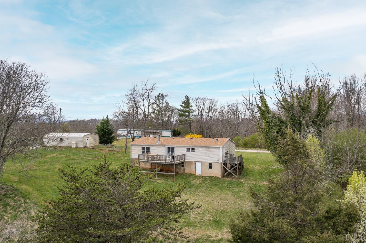 1105 Veteran Road Vinton, VA 24179 - Photo 28 of 37 a view of a big yard with potted plants and large tree