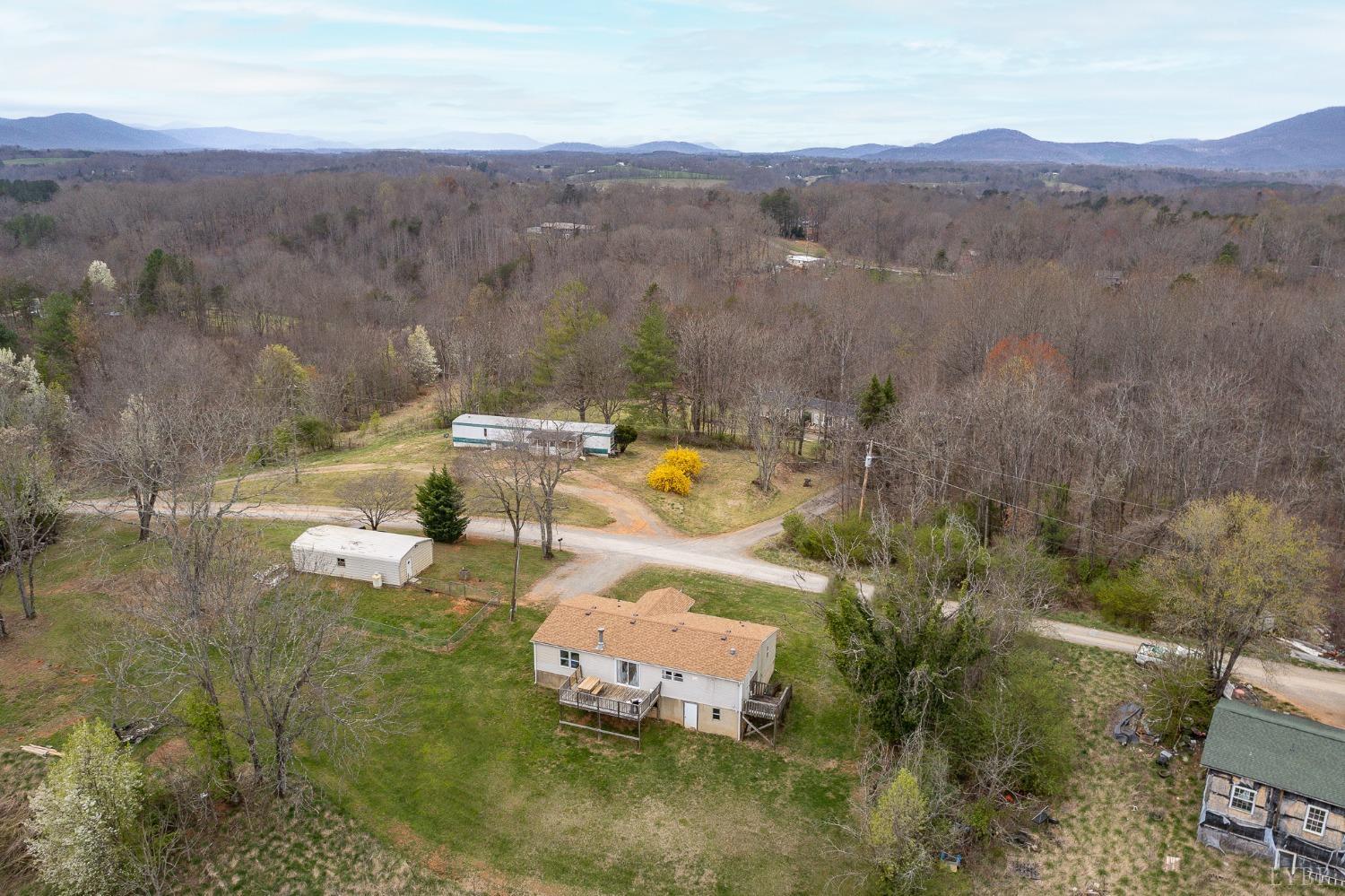 1105 Veteran Road Vinton, VA 24179 - Photo 29 of 37 a view of a lake with mountains in the background