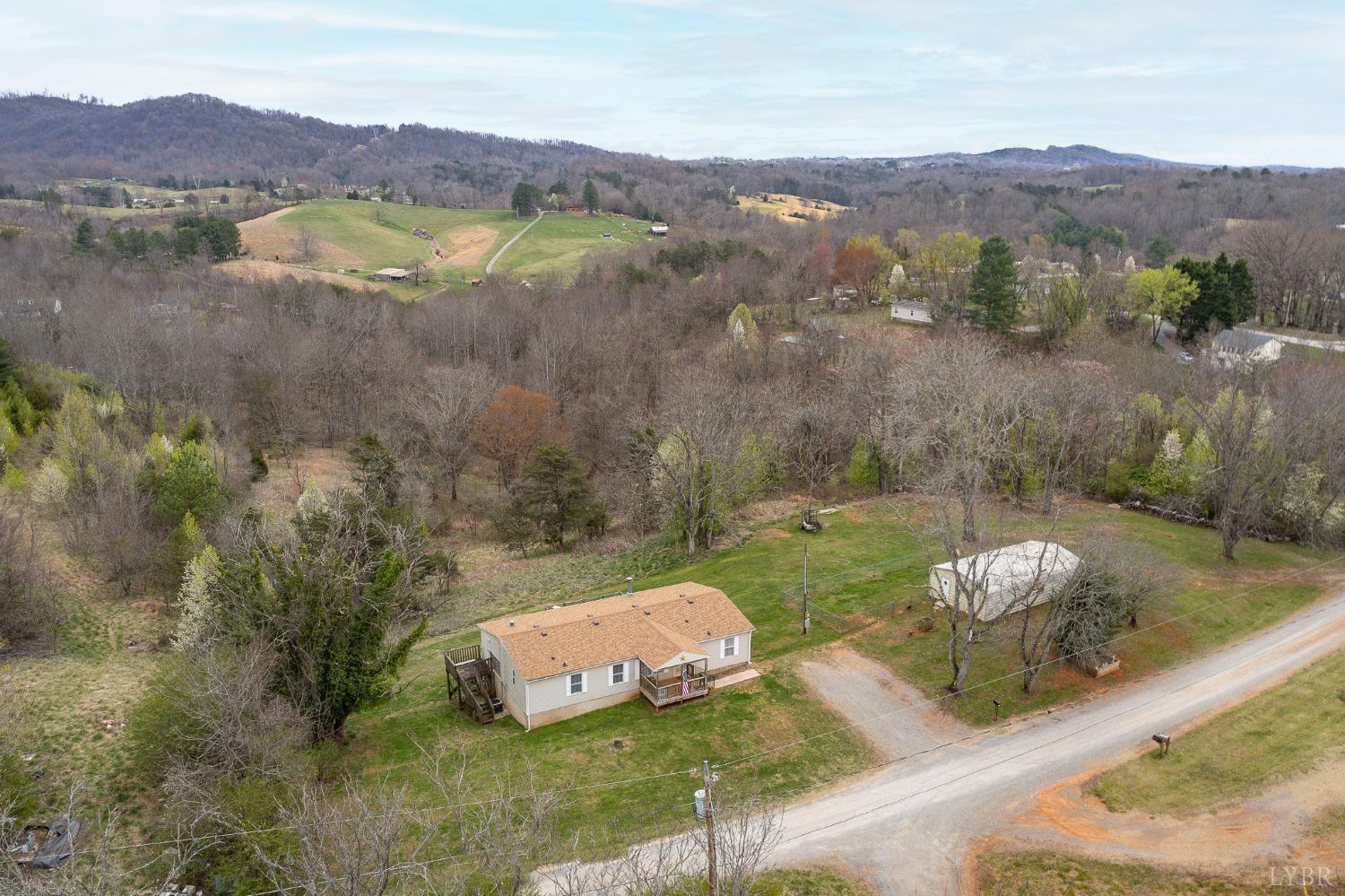 1105 Veteran Road Vinton, VA 24179 - Photo 3 of 37 a view of a lush green hillside and houses