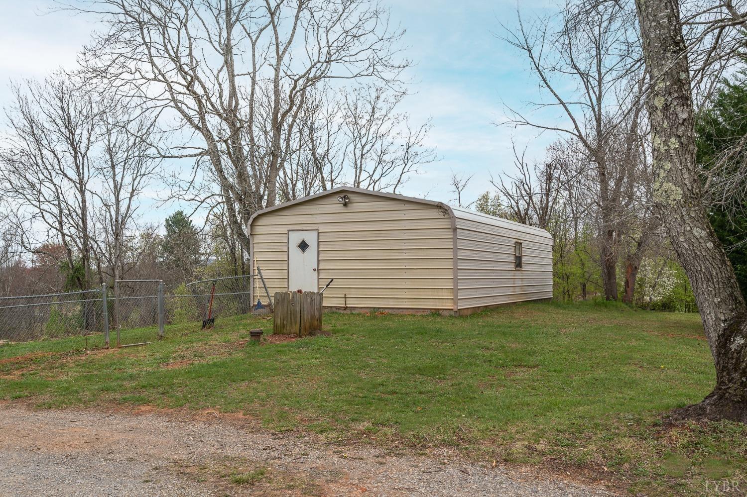 1105 Veteran Road Vinton, VA 24179 - Photo 31 of 37 a backyard of a house with lots of green space