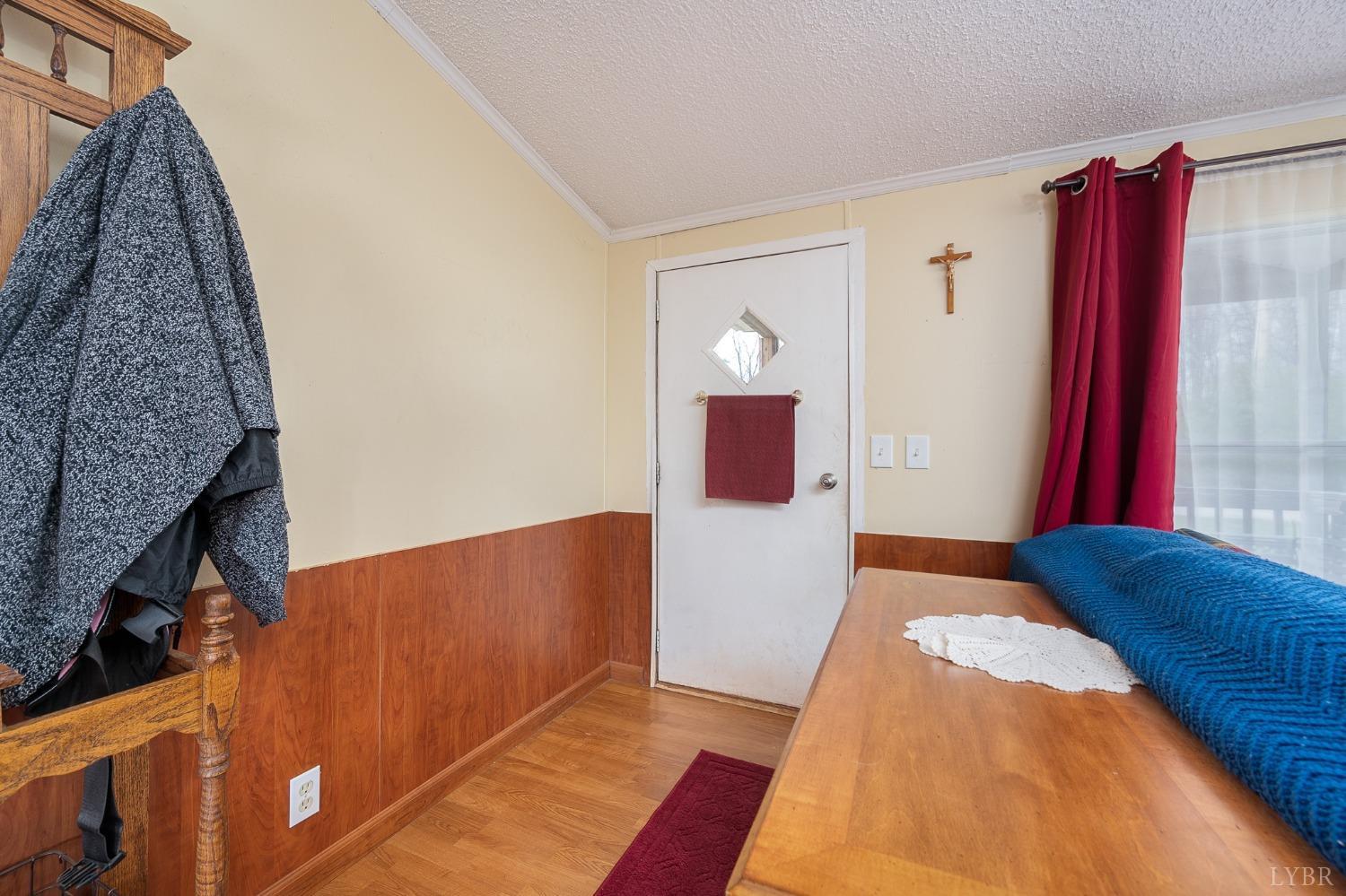 1105 Veteran Road Vinton, VA 24179 - Photo 6 of 37 a bed room with a bed and a couch