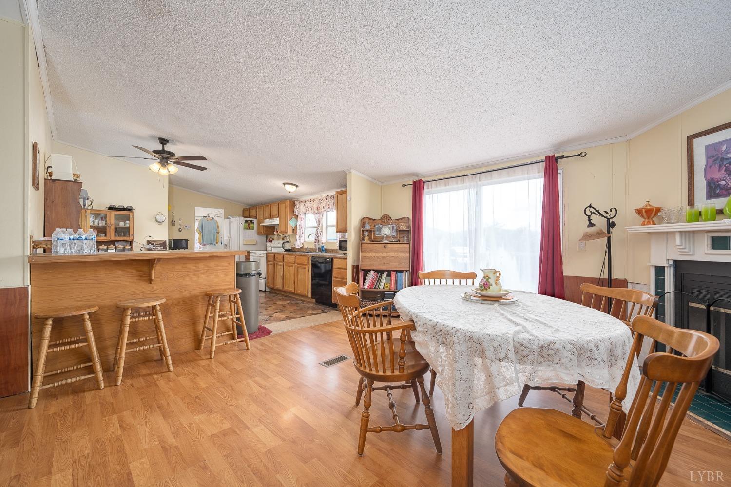 1105 Veteran Road Vinton, VA 24179 - Photo 10 of 37 a dining room with furniture and wooden floor