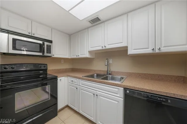 a bathroom with a toilet a sink a bath tub and mirror