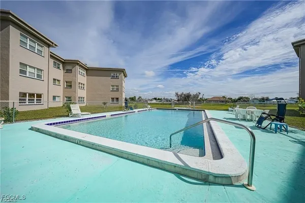 a view of swimming pool with a yard