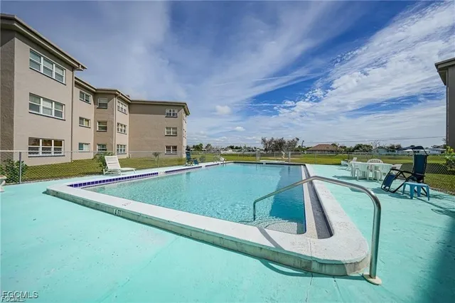 a view of swimming pool with a yard