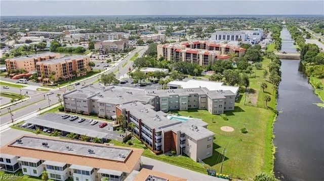a view of an entryway with wooden floor and windows