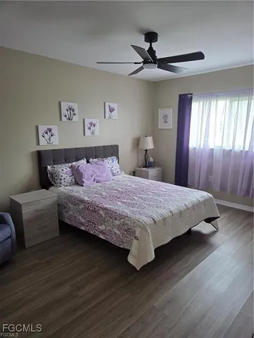 a kitchen with granite countertop a refrigerator and a sink