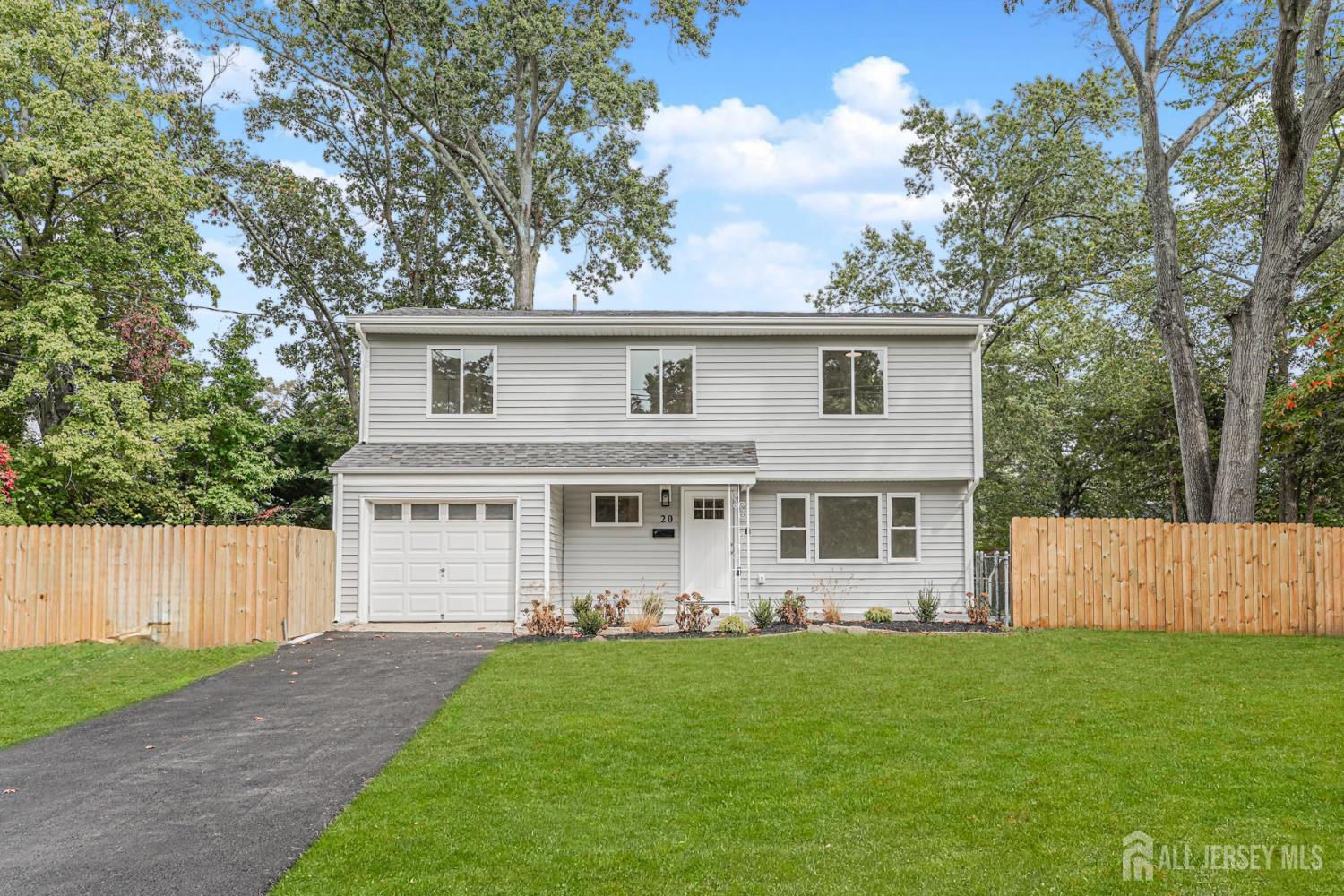 20 Daniel Road Spotswood, NJ 08884 - Photo 1 of 29 front view of a house with a yard