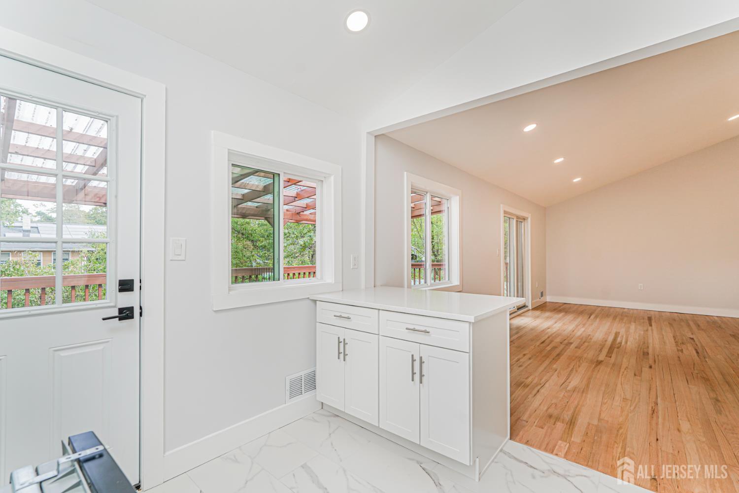 20 Daniel Road Spotswood, NJ 08884 - Photo 14 of 29 a view of a kitchen with white cabinets and a window