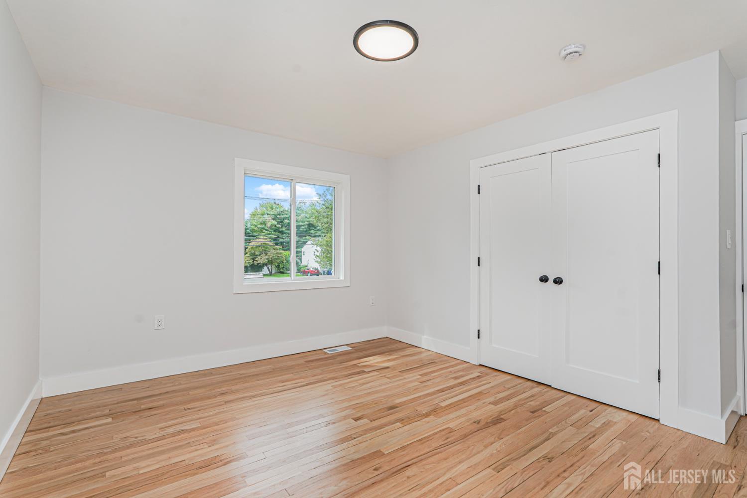 20 Daniel Road Spotswood, NJ 08884 - Photo 18 of 29 wooden floor in an empty room