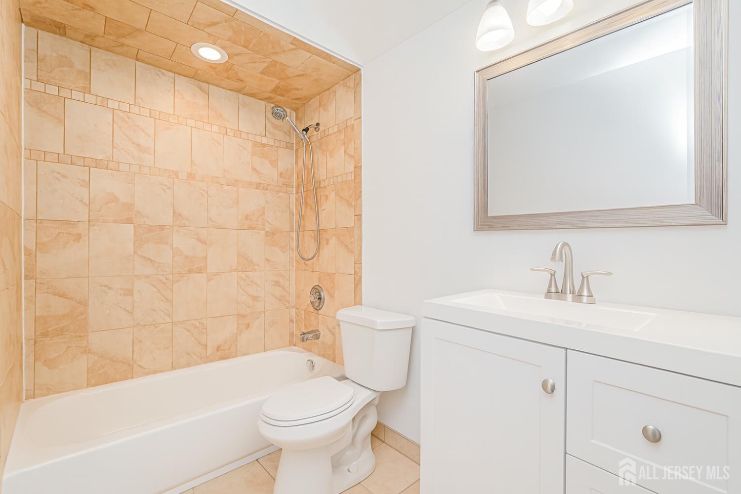 20 Daniel Road Spotswood, NJ 08884 - Photo 19 of 29 a bathroom with a sink a toilet and shower