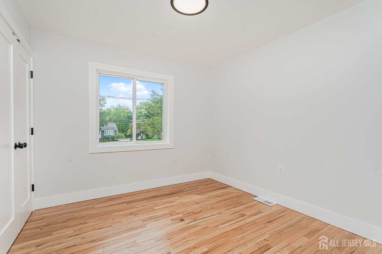 20 Daniel Road Spotswood, NJ 08884 - Photo 20 of 29 a view of a room with wooden floor and a window