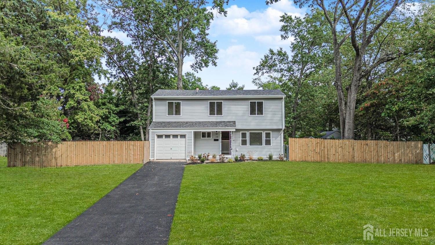 20 Daniel Road Spotswood, NJ 08884 - Photo 2 of 29 a front view of house with yard and green space