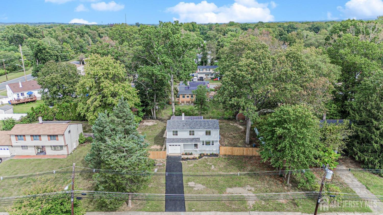 20 Daniel Road Spotswood, NJ 08884 - Photo 3 of 29 an aerial view of a house with a yard