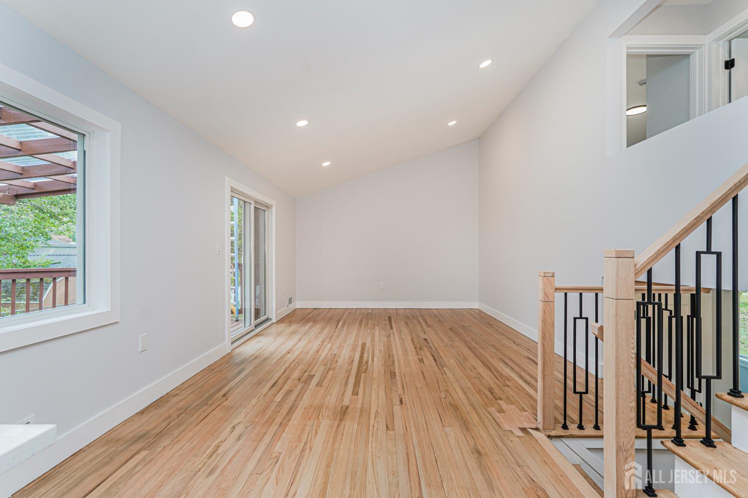 20 Daniel Road Spotswood, NJ 08884 - Photo 7 of 29 a view of empty room with wooden floor and fan
