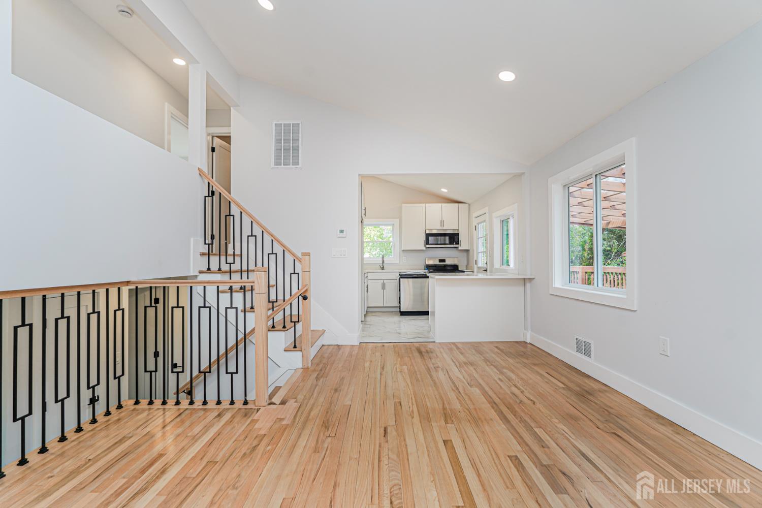 20 Daniel Road Spotswood, NJ 08884 - Photo 10 of 29 a view of a kitchen with wooden floor and electronic appliances
