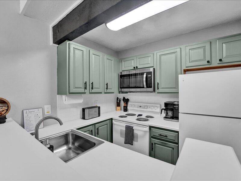 216 Snow Ridge Cir Lake Lake Harmony, PA 18624 - Photo 12 of 43 a kitchen with stainless steel appliances a microwave sink and cabinets