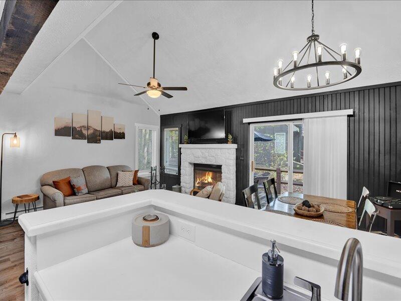 216 Snow Ridge Cir Lake Lake Harmony, PA 18624 - Photo 13 of 43 a kitchen with a chandelier a dining table and chairs