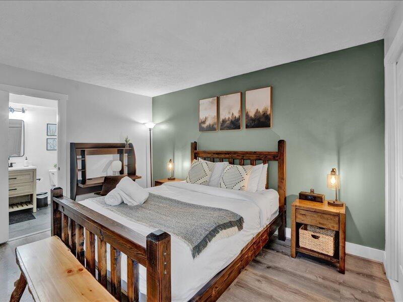 216 Snow Ridge Cir Lake Lake Harmony, PA 18624 - Photo 15 of 43 a bedroom with a bed a mirror and dresser