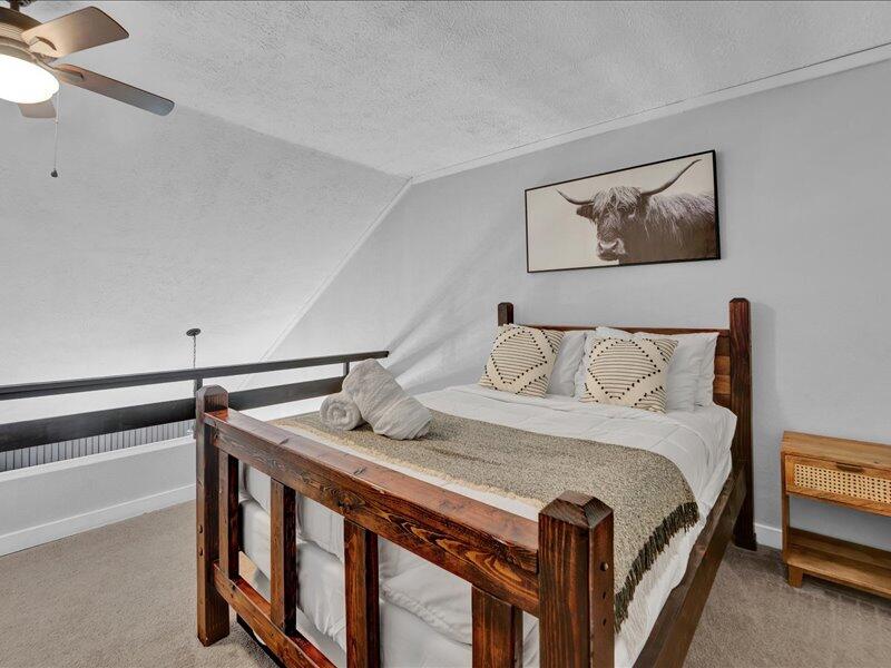 216 Snow Ridge Cir Lake Lake Harmony, PA 18624 - Photo 23 of 43 a bedroom with bed and wooden floor