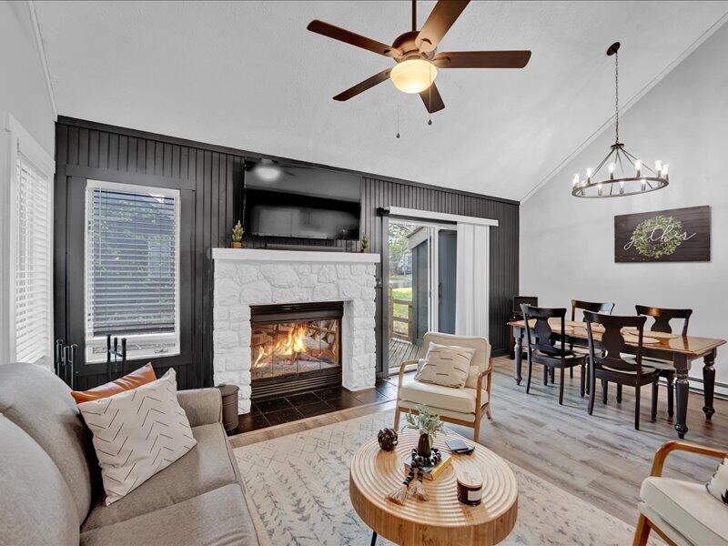 216 Snow Ridge Cir Lake Lake Harmony, PA 18624 - Photo 3 of 43 a living room with furniture a fireplace and a flat screen tv