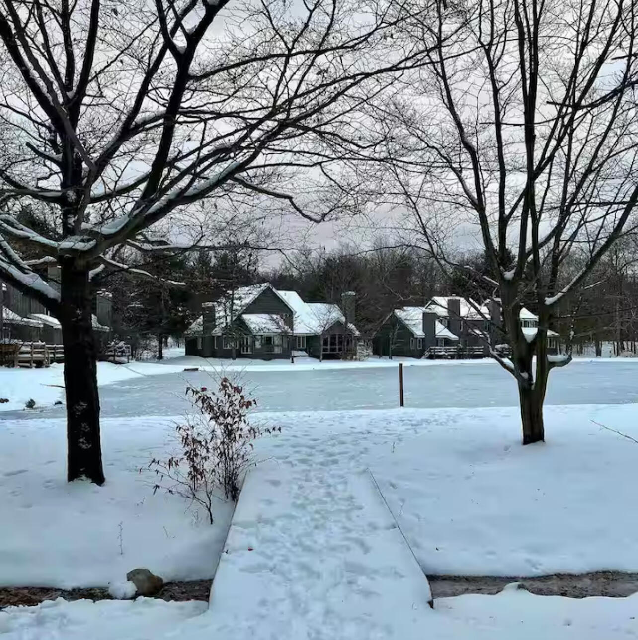 216 Snow Ridge Cir Lake Lake Harmony, PA 18624 - Photo 32 of 43 a white house that has tree in front of it
