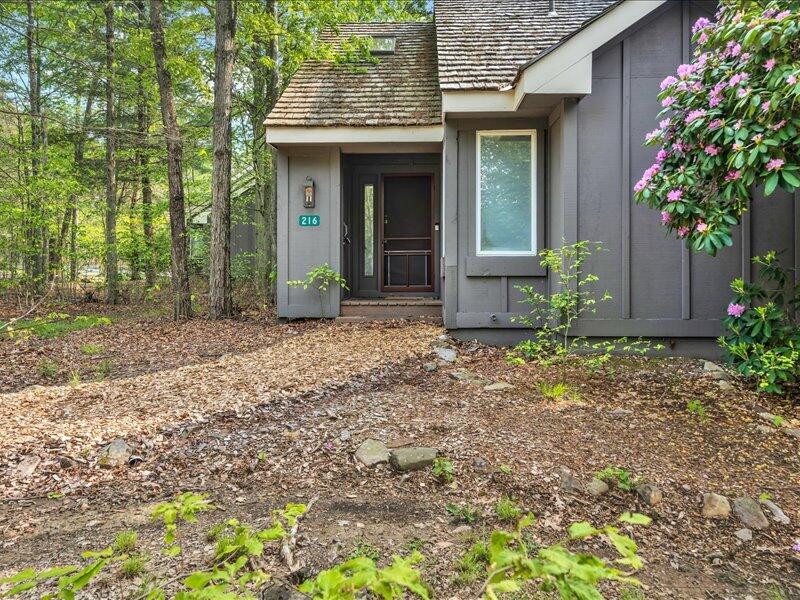 216 Snow Ridge Cir Lake Lake Harmony, PA 18624 - Photo 34 of 43 a front view of a house with garden