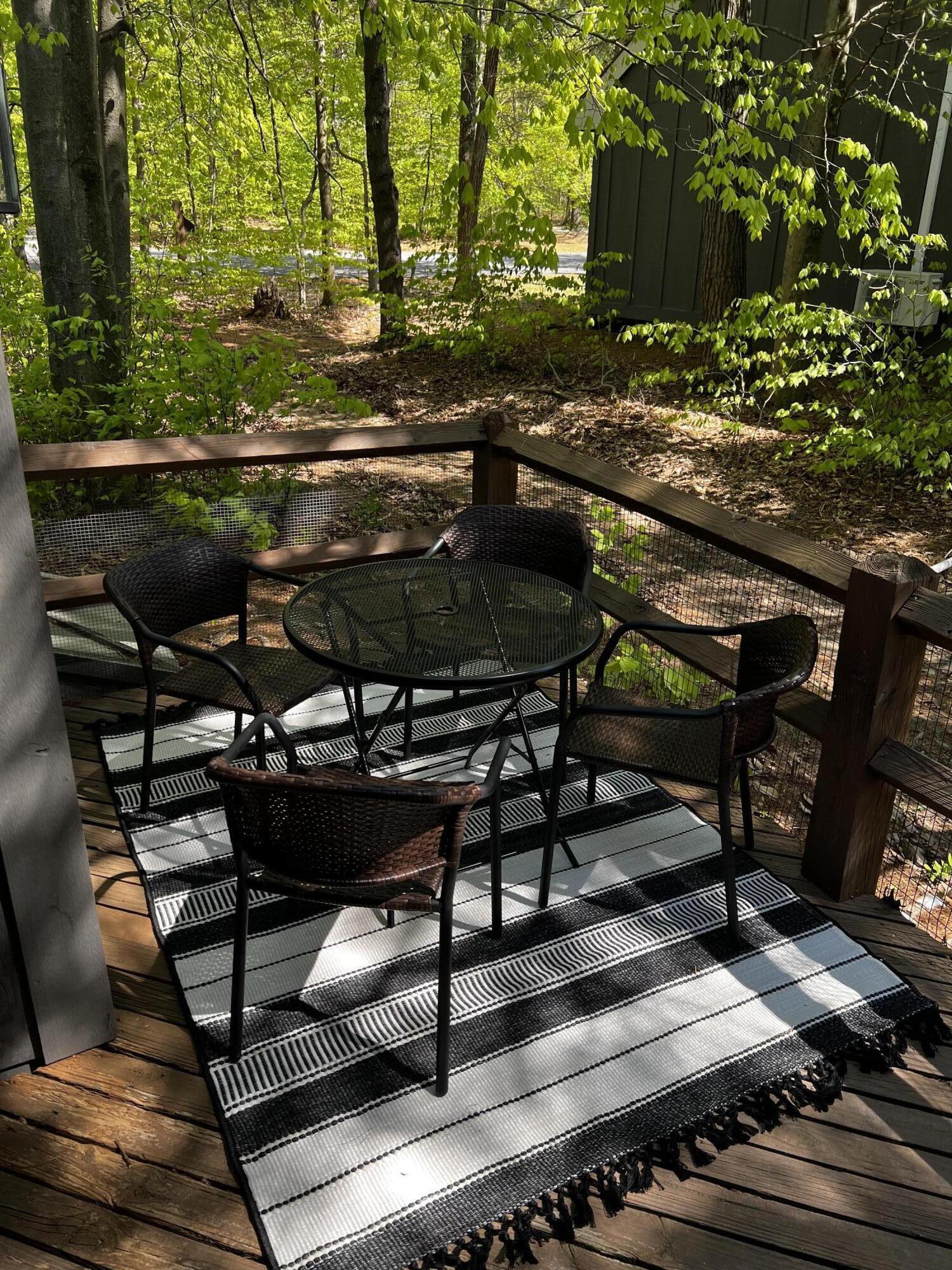 216 Snow Ridge Cir Lake Lake Harmony, PA 18624 - Photo 43 of 43 a view of a chairs and table on the deck