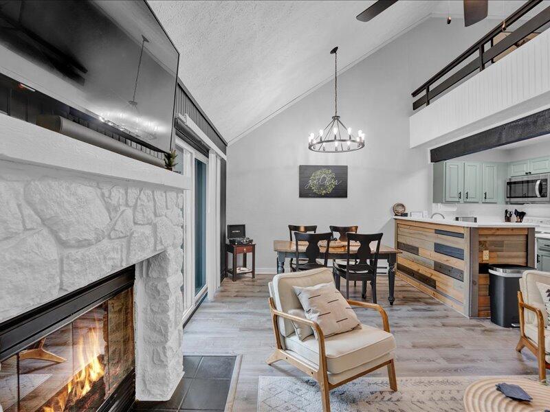 216 Snow Ridge Cir Lake Lake Harmony, PA 18624 - Photo 6 of 43 a living room with fireplace furniture and a chandelier