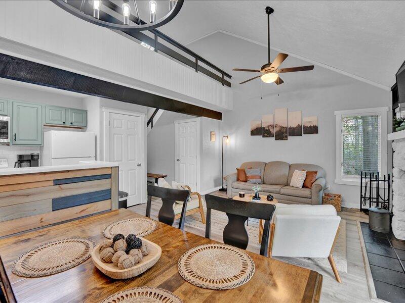 216 Snow Ridge Cir Lake Lake Harmony, PA 18624 - Photo 10 of 43 a dining room with furniture a rug and wooden floor