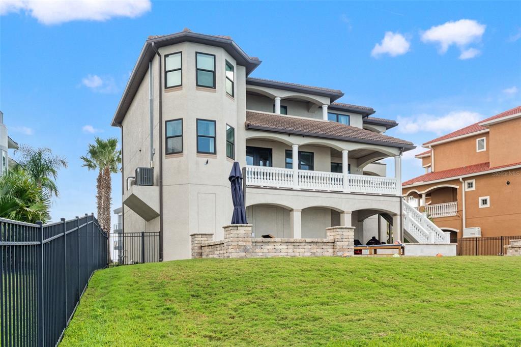 4387 Harborpointe Drive Port Richey, FL 34668 - Photo 16 of 46 a front view of a house with a garden