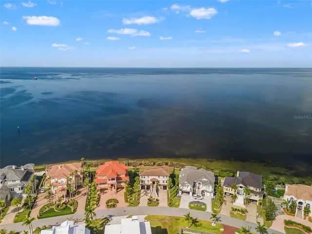 a bedroom with bed and wooden floor