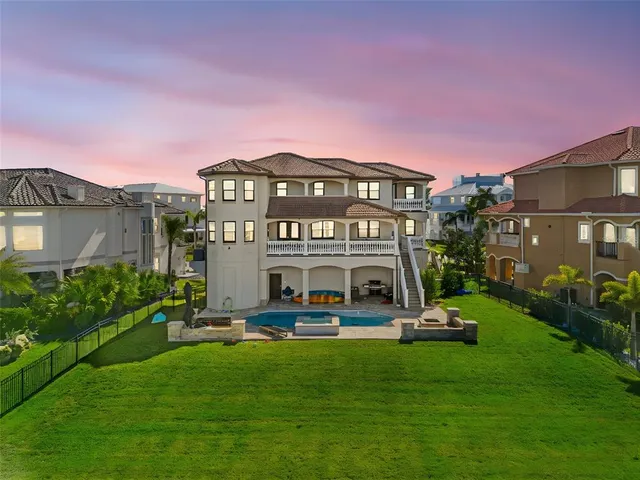 a house with swimming pool in front of it