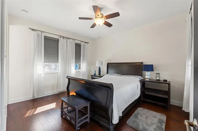 a bathroom with a granite countertop sink a toilet and a shower