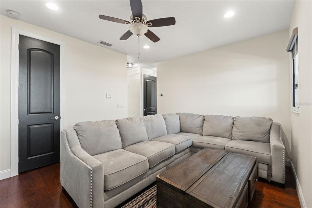 4387 Harborpointe Drive Port Richey, FL 34668 - Photo 38 of 46 a living room with furniture and a couch