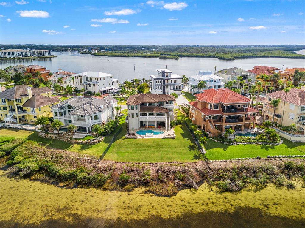 4387 Harborpointe Drive Port Richey, FL 34668 - Photo 46 of 46 a view of a building with outdoor space and lake view