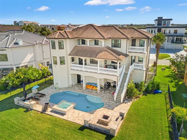 a living room with furniture wooden floor and a flat screen tv