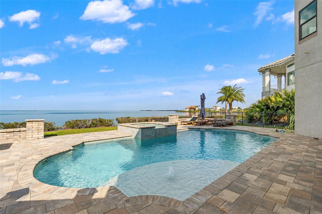 4387 Harborpointe Drive Port Richey, FL 34668 - Photo 6 of 46 a view of a swimming pool with an outdoor seating