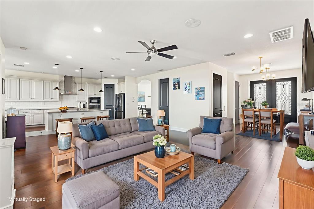 4387 Harborpointe Drive Port Richey, FL 34668 - Photo 10 of 46 a living room with furniture kitchen view and a chandelier