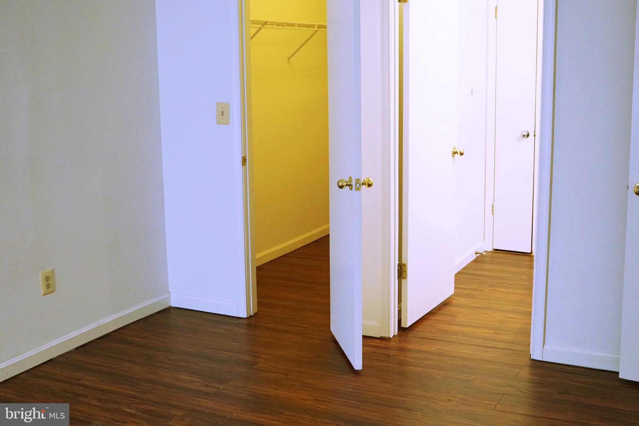 7115 Sandown Circle, Unit 202 Windsor Mill, MD 21244 - Photo 16 of 58 a view of a hallway with wooden floor