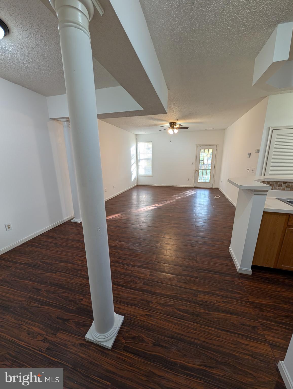 7115 Sandown Circle, Unit 202 Windsor Mill, MD 21244 - Photo 49 of 58 a view of entryway and hall with wooden floor