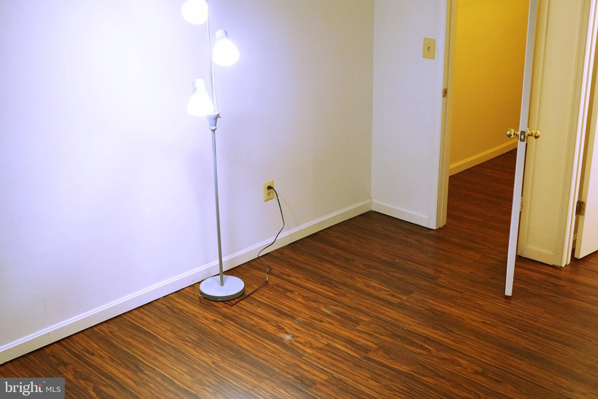 7115 Sandown Circle, Unit 202 Windsor Mill, MD 21244 - Photo 6 of 58 a view of a room with wooden floor