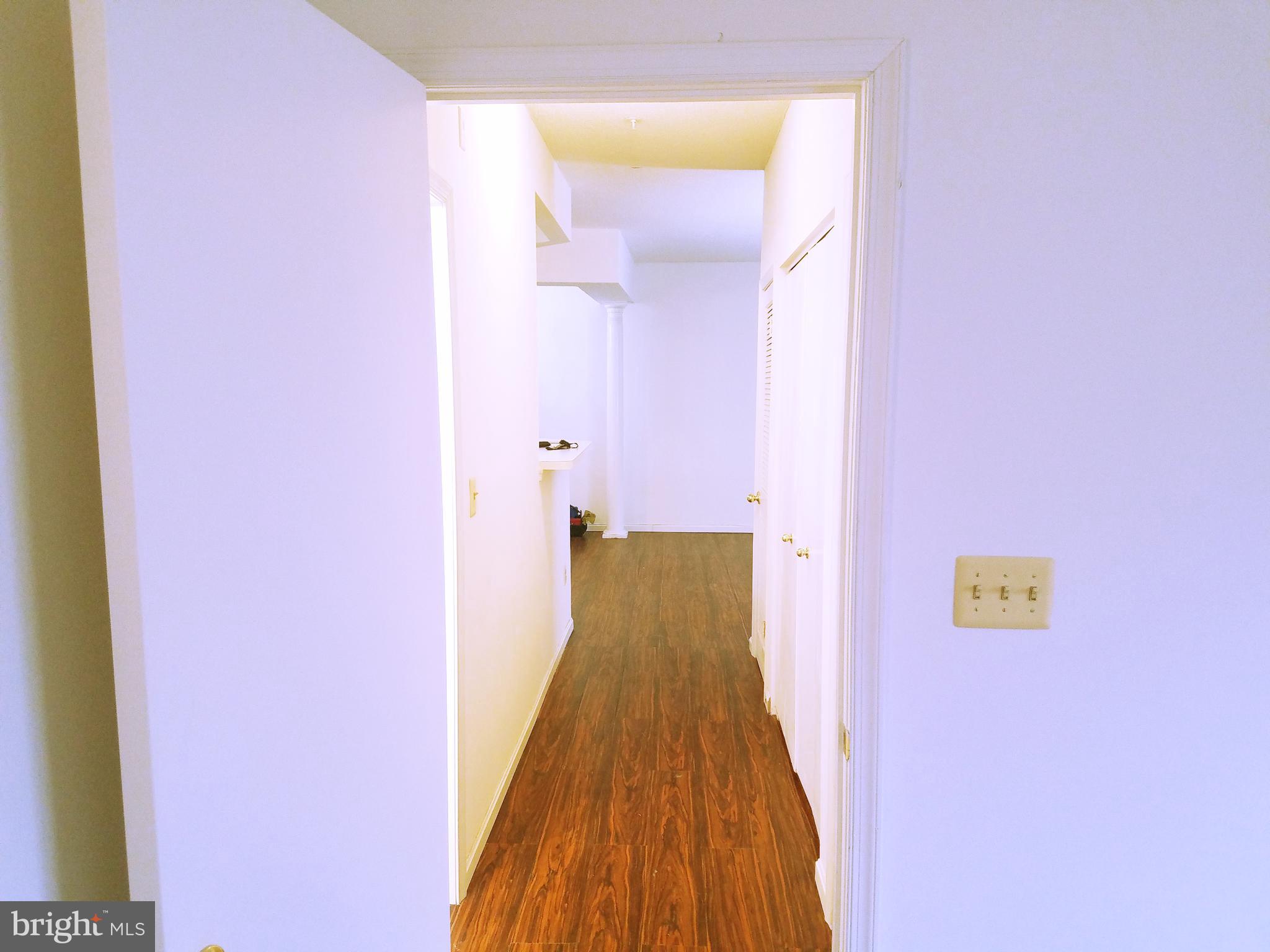7115 Sandown Circle, Unit 202 Windsor Mill, MD 21244 - Photo 9 of 58 a view of a bathroom with a sink and a mirror