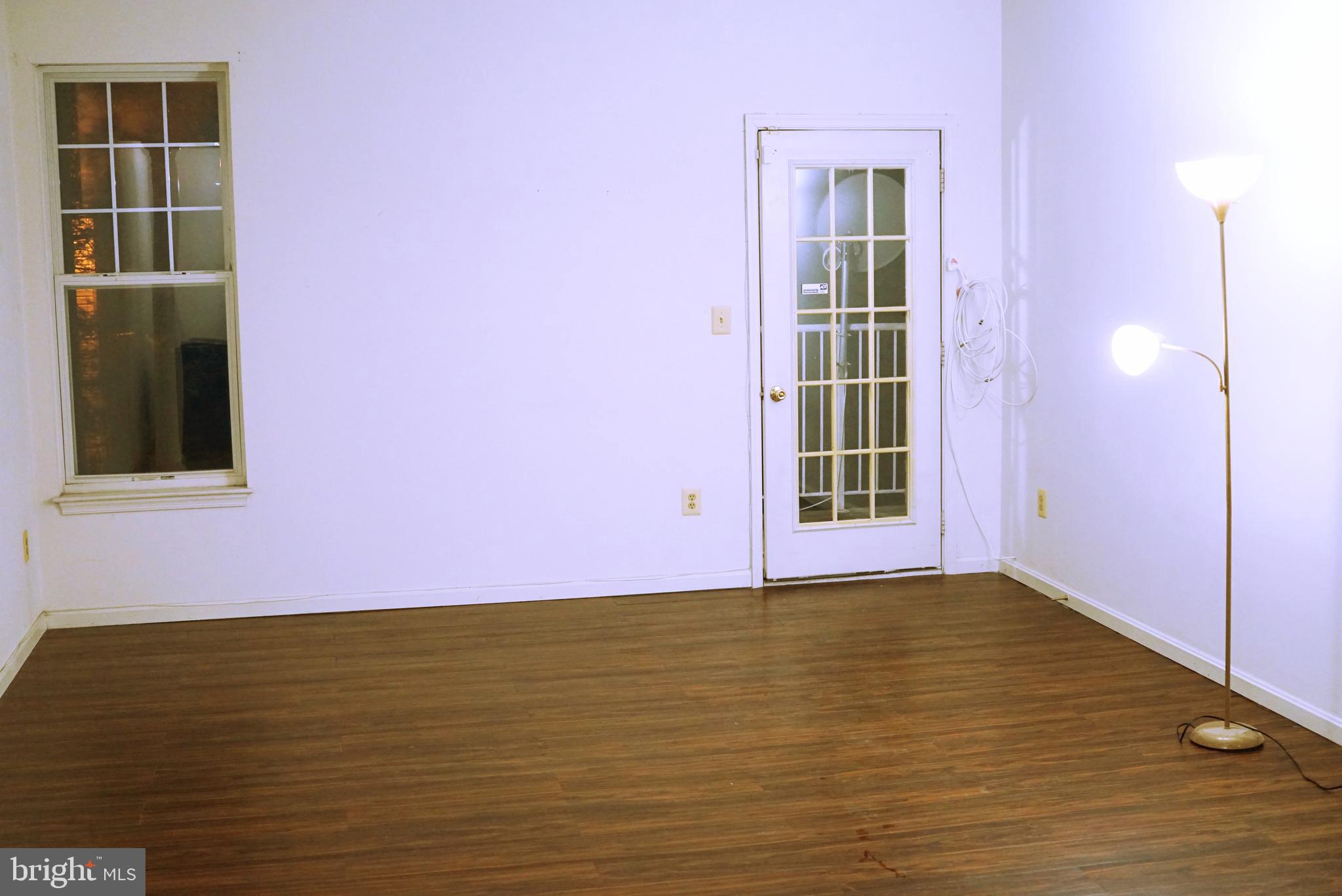 7115 Sandown Circle, Unit 202 Windsor Mill, MD 21244 - Photo 10 of 58 a view of an empty room with a window