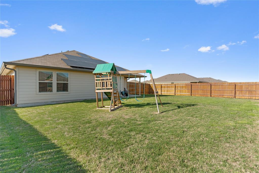 7100 Canadian Drive China Spring, TX 76633 - Photo 13 of 16 a backyard of a house with table and chairs