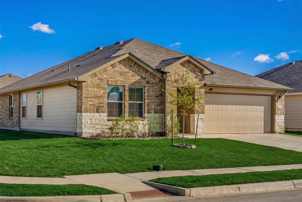 7100 Canadian Drive China Spring, TX 76633 - Photo 3 of 16 a front view of a house with garden